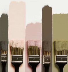 three paintbrushes with different shades of pink and grey on them, one is black