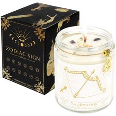 the zodiac sign candle is next to a box