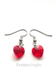 These Crystal Heart Earrings are very pretty and sparkly! The crystal heart is made by Swarovski and they named the color, Light Siam, a bright red.There are six silver beads on each jump ring - three in the back and three in the front. The earwires are stainless steel and the beads are silver plated. The earring dangles 1 inch from the coil on the earwire. Plastic earring backs are included. These pretty earrings are ready to ship and will arrive in a white gift box. Check out other heart jewel Heart-shaped Crystal Earrings For Gift, Heart-shaped Crystal Earrings For Valentine's Day, Heart-shaped Crystal Earrings, Irish Earrings, Valentine Earrings, Celtic Knot Jewelry, Celtic Knot Necklace, Red Heart Earrings, Crystal Heart Earrings