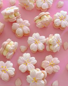 pink and white cookies with flowers on them