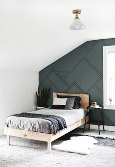 a bedroom with green walls and white carpet