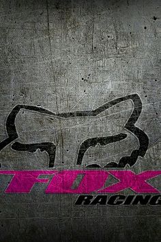 a pink fox racing logo on a black and gray background with the word fox racing