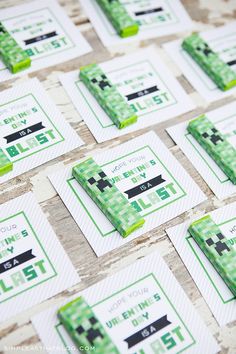 some green and white business cards on a table