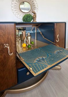 an art deco sideboard with blue and gold accents