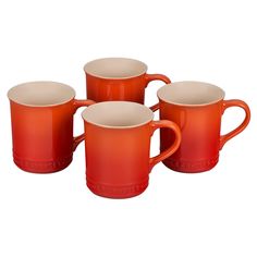 four red coffee mugs with white rims