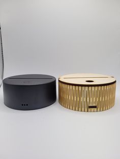 two speakers sitting next to each other on a table