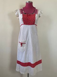 All measurements taken lying flat, and are approximate Bust: 44cm Waist: 38cm Hip: 57cm Length: 108cm  Label: no label, appears to be handmade Fabric type: muslin Condition: in excellent vintage condition Red Cotton Sundress With Ruffles, Vintage White Sundress With Floral Print, Vintage White Floral Print Sundress, White Vintage Floral Print Sundress, Sleeveless Summer Pinafore Dress For Garden Party, Summer Sleeveless Pinafore Dress For Garden Party, Red Cotton Sundress For Garden Party, Cottagecore Summer Dress With Pockets, Vintage White Sundress For Garden Party