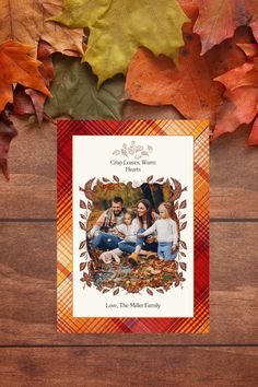 an autumn card with leaves surrounding it