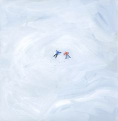 two skiers are flying through the snow