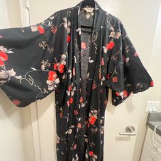 Vintage Ichi Ban Quality Japan Authentic Long Kimono Robe Rejoice In This Timeless Classic! Crafted With Authentic Japanese Style, The Vintage Ichi Ban Quality Japan Authentic Kimono Robe Is Sure To Be A Staple Item In Your Wardrobe. This Gorgeous Kimono Robe Is Truly A Piece Of Wearable Art. From Its One Size Fits All Design, To Lush Fabric That Drapes Gracefully, You Can Treasure It For Years And Stand Out With A Unique Look. What's More, This Kimono Robe Is Brand New With Tags, Meaning You Ca Black Cotton Kimono For Summer, Fitted Black Kimono For Beach, Black One Size Kimono, Black Long Sleeve Kimono With Floral Print, Black Fitted Long Kimono, Fitted Long Black Kimono, Black Cotton Kimono With Kimono Sleeves, Black Cotton Kimono With Print, Black Printed Cotton Kimono