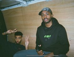 two young men sitting next to each other