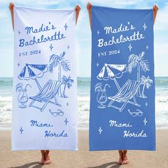 two beach towels with the names of different destinations on them, one blue and one white