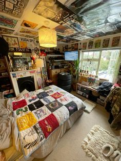 a bed room with a neatly made bed and lots of clutter on the walls