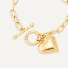 Steal all the attention at your next event with this trendy heart charm T-bar bracelet. This beautiful piece would make a great fashion accessory to any event - work or play.Featuring a modern T-bar clasp for ease of wear. Gold-Tone Plated | Nickel, Lead, and Cadmium Free Product Code: DB2149K Collection: Sweetheart Type: Clasp Material: Stainless Steel Dimensions: Length 18-21cm Pendant Dimensions: Style: Heart & Chain-Link Includes: Metal Heart Bracelet With Toggle Clasp, Trendy Metal Bracelets With Heart Charm, Elegant Heart Bracelet With Toggle Clasp For Valentine's Day, Elegant Valentine's Day Bracelets With Toggle Clasp, Trendy Chain Bracelet With Heart Charm For Valentine's Day, Trendy Heart Charm Chain Bracelet For Valentine's Day, Metal Heart Bracelet For Everyday, Trendy Metal Heart Charm Bracelet, Valentine's Day Gift Bracelet With Toggle Clasp