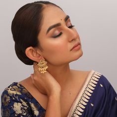 Description Inspired from the shimmering Indian gold jewelry. This Collection is designed to highlight the fine Indian craftsmanship. It is crafted in gold-plated 925 silver with intricate textures and tones. Modern designs adorn you with timeless floral patterns. This jewelry is perfect for wedding and festival events. Created by Paksha design experts, the Swara Triangle Floral Silver Earrings feature beautiful pearl hangings , coming together in a joyful dance. The triangle shape stud is desig Indian Gold Jewelry, Textures And Tones, Gold Jewelry Indian, Triangle Shape, Silver Drop Earrings, Floral Patterns, Silver Earrings, Gold Jewelry, Floral Pattern