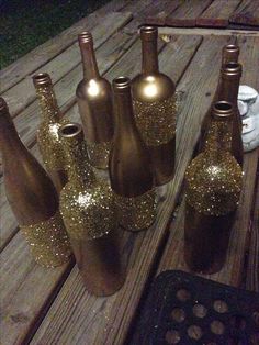 a group of wine bottles sitting on top of a wooden table