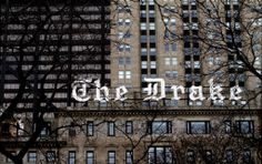 an old building with the word'the brake'painted on it in front of some bare trees