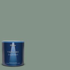 a can of marquee white paint on a gray background with the words marquee written below it