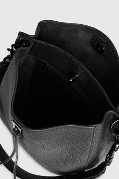 Divide and conquer with the perfect everyday bag. Made of supple leather, The Darren Shoulder Bag has a divider to compartmentalize your essentials—so you stay organized on the busiest of days. Style #: HH19MDND28 100% Genuine leather Black Shellac hardware Gunmetal studs on strap 10. 5"W X 11. 0"H X 4. 25"D 13. 5-20. 5" Adjustable Strap 1 Interior zip pocket 1 Exterior slide pocket Turn lock closure Unlined Imported The photos featuring a model are for size reference only. Actual color and mate Leather Business Bags With Gunmetal Hardware, Business Leather Bags With Gunmetal Hardware, Business Bags With Gunmetal Hardware And Leather, Modern Business Bags With Gunmetal Hardware, Versatile Leather Satchel For Business, Leather Satchel With Gunmetal Hardware For Daily Use, Leather Shoulder Bag With Gunmetal Hardware For Business, Business Top Handle Bag With Gunmetal Hardware, Business Satchel With Gunmetal Hardware In Tote Shape