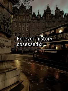 a double decker bus driving down a street next to tall buildings with the words forever history obsesed above it