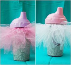 a baby bottle decorated with tulle and a pink sippy cup