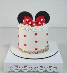 a mickey mouse cake with red and white polka dots