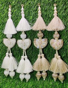 Indian Handmade Latkan Tassels for Saree Blouse Lehenga HandBags Hangings Dupatta Decoration Bridal Wedding dress for Women pair of 2 pcs Size - 22.00 cm Length  Item Description You can use this Beautiful pair of tassle for several DIY projects.  *These beautiful Tassel Latkans are used as the accessory for saree blouse on the back, but u can use according to your need and your innovative ideas. * Package contains 2 Latkan / 1 Pair Other Than Saree Blouse, you can use these latkans in various ways Craft Projects Designing Home Decoration Festive celebrations. Evening and party Apparels. Home décor items Apparel & Fashion Scarves n Stoles Headband, hats Table cover, curtains, Pillow covers, Cushion cover Shoe designing Headband, hats Table cover, curtains Designing stylish blouses Ship Fro Cheap Latkans Drop Earrings, Luxury Traditional Wear With Latkans For Women, Luxury Saree With Latkans For Festive Occasions, Luxury Chandbalis With Latkans For Celebrations, Cheap Dangle Chandelier Earrings With Latkans, Latkan Tassels Blouses Handmade, Cheap Jewelry With Latkans For Diwali, Elegant Cheap Danglers With Latkans, Cheap Chandbalis With Latkans