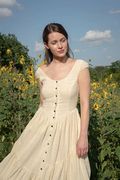 One of our favorites -- the perfect summer dress. One of our most popular styles, the Claudette cap sleeve dress is made of airy, breathable 100% organic Kala cotton crepe with a button up front and dramatic asymmetrical lace hem. A fitted bodice and full skirt make the Claudette the perfect statement piece for special moments or for making the everyday feel a bit more magical. A lovely yet elegant dress that just makes you feel beautiful. Farmhouse Fashion, Long Kurta Designs, Nursing Friendly Dress, Long Kurta, Summer Styling, Cottagecore Fashion, Cap Sleeve Dress, Feel Beautiful