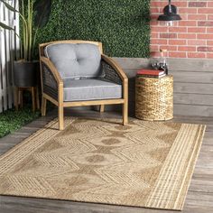 a chair sitting on top of a wooden floor next to a potted green plant