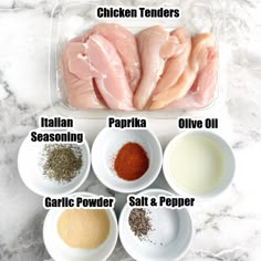 the ingredients for chicken tenders in bowls on a marble counter top, including seasoning, garlic powder, salt and pepper