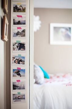 a bedroom with pictures hanging on the wall