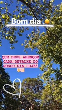 a sign that is in front of some trees and the words bom dia on it