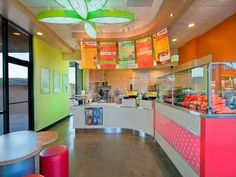 the inside of a fast food restaurant with bright colors