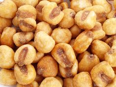 a pile of fried food sitting on top of a white plate