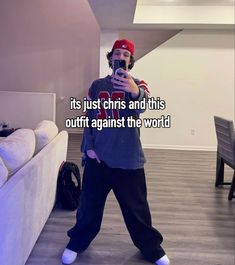 a man taking a selfie in his living room with the caption it's just chrs and this outfit against the world