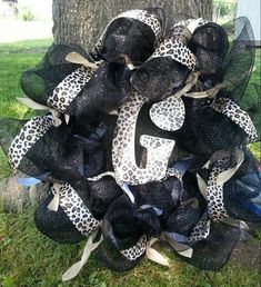 the wreath is decorated with black mesh and leopard print