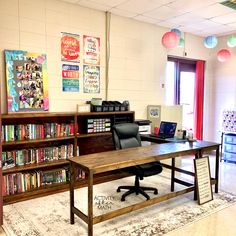 an office with bookshelves, desk and computer