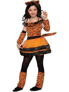 Your kid can take a walk on the wild side this Halloween with our Kid's Tiger Cub Costume. But that doesn't mean he or she has to look like a beast while doing so. In fact, this adorable set will do anything but that. It comes with the cutest little tiger striped dress that has an attached tail, a headband equipped with fuzzy ears, adorable sleevelettes, and leg warmers. Now, of that isn't the cutest thing you'll ever see, we don't know what is! Jungle Costume, Tiger Halloween Costume, Halloween Forum, Tiger Cub, Theatre Costumes, Costume Themes, In The Jungle, A Tiger, Tiger Stripes