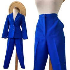 "Royal Blue Woven Pant Suit (2 piece)  Can be worn by many ages  Measurements 👇🏼 Size: Pants (12 P)  Measurements Waist: 31\" Inseam: 27\"  (at the ankle) Rise: 13.5\" Size: Blazer (8P) Measurements Length: 27\" Armpit to Armpit: 20\" This color is absolutely STUNNING. Statement Suit with the WOW AFFECT. A MUST Have!  Pants have pockets.  Waist has an elastic waist on the back for extra Give.  Perfectly Lined. Excellent Craftsmanship.  Ready to wear !" Spring Suits With Pockets, Spring Full Length Suits With Pockets, Spring Full-length Suits With Pockets, Fitted High-waist Workwear Sets, Fitted High-waist Sets For Workwear, Blue High Waist Sets For Spring, Blue Trousers Sets For Spring, Fitted Full-length Sets With Pockets, Fitted Wide Leg Set With Pockets