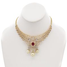 18K Yellow Gold Diamond Bridal Necklace & Earrings Set W/ 8.17ct Diamonds, Rubies & Pearls for women. This exquisite bridal set features a choker necklace and matching Chandbali earrings with a design encrusted in 8.17ct VVS diamonds, precious rubies and drop pearl accents. This unique set has a total gold weight of 71.55 grams. Traditional Yellow Gold Bridal Necklace With Diamond Accents, Festive Yellow Gold Diamond Bridal Necklace, Luxury Diamond Jewelry Sets For Festive Season, Fine Jewelry Gold Bridal Necklace For Reception, Diamond Bridal Necklace In Yellow Gold For Reception, Yellow Gold Diamond Bridal Necklace For Reception, 22k Gold Jewelry With Diamond Accents For Wedding, 22k Gold Wedding Jewelry With Diamond Accents, Fine Jewelry 22k Gold Wedding Necklaces