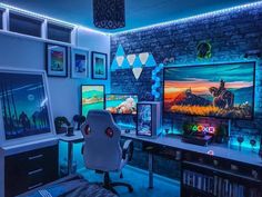 a gaming room with two monitors and several games on the wall, all lit up