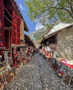 an outdoor market with lots of items on display