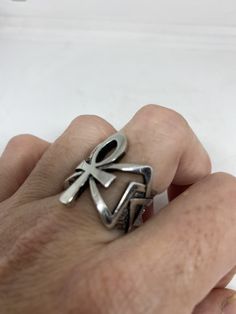 Cool Vintage Rock and Roll star men's ring Nice heavy ring vintage casting in silver white bronze Unused stock from the 1980's I have an assortment of sizes from 6.75, 7, 7.75, 12.75, 13, 13.25, 13.75 14 and 14.25 some half sizes. Please add your size to the order in a message and I will send the size you require. If I am out of stock in your size, I will list the ones I have available for replacement. My jeweler can re size them for a $20 fee. If I am sold out in the sizes you would prefer, I w Retro Silver Rings For Collectors, Vintage Silver Ankh Jewelry, Vintage Antique Silver Metal Rings, Retro Silver Ring Jewelry, Retro Silver Ring, Egyptian Ankh, Men Ring, Vintage Rock, Men's Ring