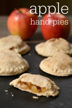 apple hand pies on a baking sheet with an apple in the background and text overlay