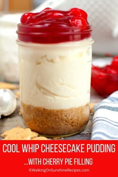 a jar filled with cheesecake pudding on top of a table