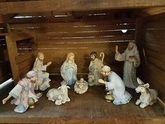 a nativity scene with figurines in the manger