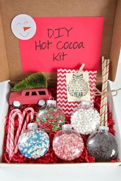 the diy hot cocoa kit is packed with candy, candies and christmas decorations