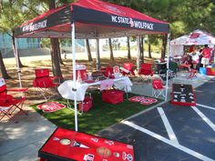 red and white tents set up in the middle of a parking lot