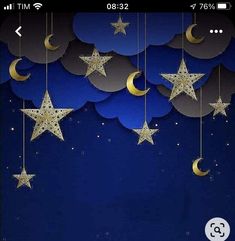 stars and moon hanging from strings in the night sky