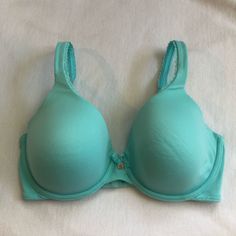 Victoria’s Secret Bra Size: 32dd Style: Lined Full Coverage Color: Light Blue/Sea Foam Green - Worn - Good Condition Still, Pilling Shown In Photo But I Believe Can Both Be Fixed - Only Hung Up To Drip Dry, Never Used Drier - Detailing As Shown In Photo Original Price: $60 Comment If You Have Any Questions! Stretch Underwire Bra In Light Blue, Light Blue Stretch Underwire Bra, Fitted Victoria's Secret Bra, Fitted Padded Green Bra, Green Padded Fitted Bra, Fitted Green Padded Bra, Fitted Padded Blue Bra, Victoria's Secret Blue Summer Bra, Color Light Blue